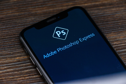 Photoshop logo on an iPhone X screen. iPhone camera flipping