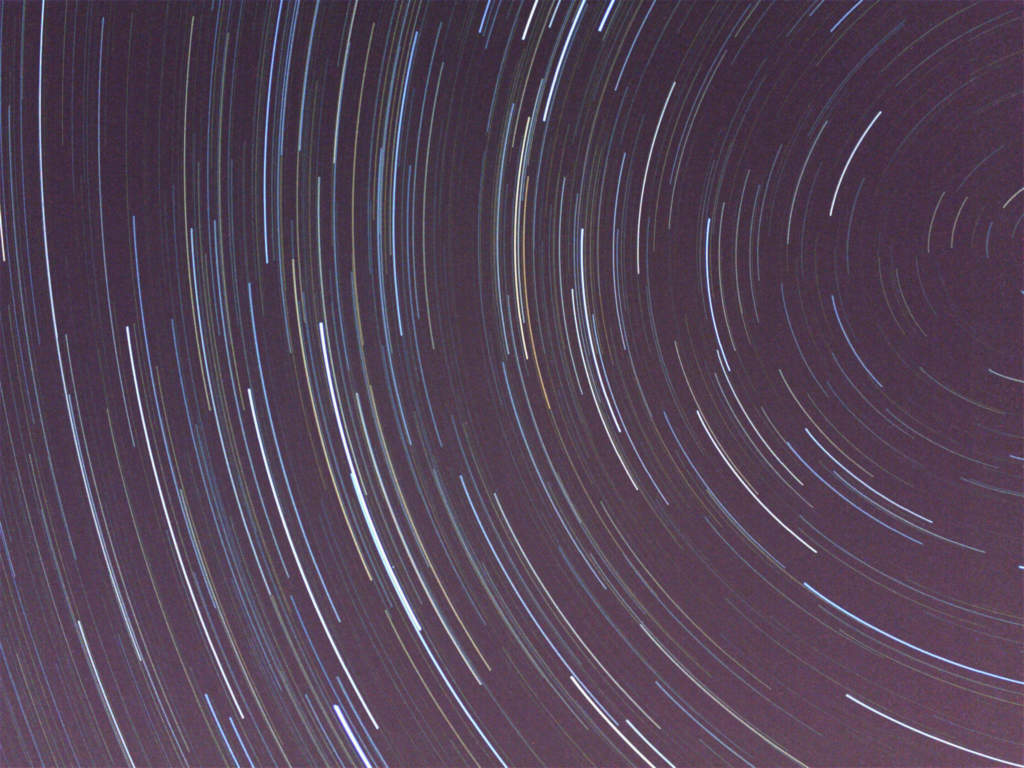 a vibrant photo of Star Trails by Andy Stones - capture stars with iPhone