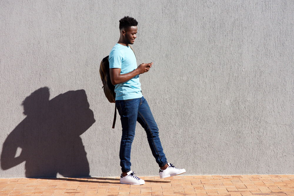 African-American guy walking on the street - iPhone camera burst mode
