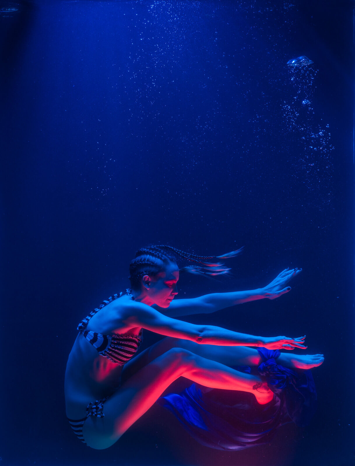Photo of Woman Swimming Underwater - iPhone camera burst mode